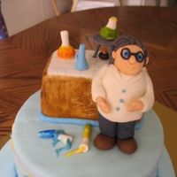 Chemist Birthday Cake This was my fisrt order and my 4th cake. Hope the boy will like it. Chocolate cake w ganache and fresh raspberries, covered in fondant. All...