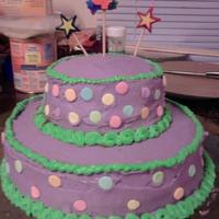 Giant Sprinkle Cake Purple cake with green borders and giant sprinkles.