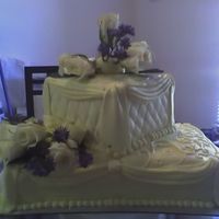 10-28-06_1130.jpg First paid wedding cake. I added more flowers to the top later.