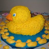 3D Rubber Ducky Baby Shower Cake I made this rubber ducky for a baby shower at work. I also made the ducky candy around the cake and put blue & pink cupcakes around the...