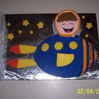 Outer Space Cake This was done using the football pan and a one layer 6in. pan. Most of the decorations are done in fondant. This was for a Boy Scout...