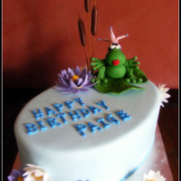 Paige Chocolate mud cake with chocolate ganache and blue fondant, frog/flowers of fondant.