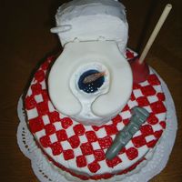Retirement Plumber Cake 8" round buttercream with fondant toilet, and gum drop fish and chocolatetools.