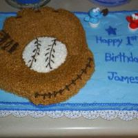 First Birthday Cake 1/2 sheet cake with baseball mitt, done in buttercream. Took liberty with Cookie monster and Elmo finger puppets by adding a mitt and ball...