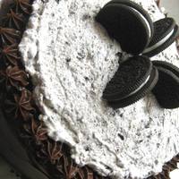Cookies And Cream Cake Dark chocolate cake filled with cookies and cream, iced with a dark chocolate buttercream
