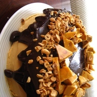 Chocolate Peanut Butter Cake Dark chocolate cake filled and iced with peanut butter cream cheese frosting, covered in a dark chocolate peanut butter ganache topped with...