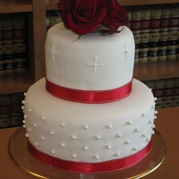 Simplicity Wedding cake after a civil ceremony at the courthouse. Ivory fondant with fondant pearls dusted with super pearl dust. Purchased ribbon and...