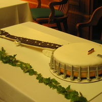 Banjo This is a life-size banjo cake without strings. I used fondant everywhere except the frets (marking where the player puts her fingers),...