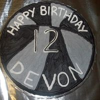 Basketball Birthday Cookie Done for a friend's son who wanted a basketball cookie using Spurs colors. He wanted silver (not gray), so I added some crushed up...