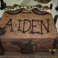 Cowboy Birthday Cake Made this one for my son's 3rd birthday. Chocolate cake with chocolate buttercream. Chocolate molds for the horseshoes, horse, boots...