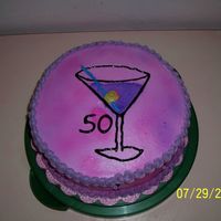 50Th Birthday Cake Buttercream Icing with piping gel for the outilne on the martini glass and then sprayed with the wilton food color mist