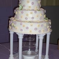 Butterfly Wedding Cake My friend found this cake done in all white in a wilton book, her colors were lavender and yellow and her theme was butterflies. I made the...
