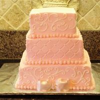 Pink/square Wedding Cake Pink buttercream, square cakes 6", 8" and 10". The border and bow were fondant. This cake design was taken from a picture...