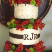 Wedding Cake Three layer with ivory cream cheese buttercream. Used 2" separators and color flow monogram. Brown ribbon was fondant. I also used...
