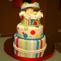 Baby Shower - Suprise It's A Boy! Baby boy shower cake. Baby is made out of modeling paste. Cake covered in fondant and bow made out of a combination of fondant and tylose...