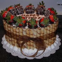 Mmmmmm.....chocolate! Choclate cake with strawberry cream filling. Iced with bc, chocolate hazelnut rolled cookies and chocolate dipped starwberries. I wish I...