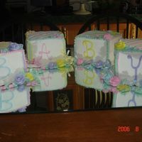 Assoted_001.jpg 4 three layer cakes iced in buttercream. I set them on a mirror for added effect. My daughter loved it!