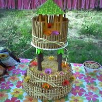 Hawiian Wedding Cake This was my second wedding cake it was a Hawaii themed. I used cookies for the outside and foam to cover the pillars to look like palm...