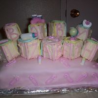 Baby Shower Cake This is a baby shower cake I made for my boss. I used a white cake mix with rasberry filling for the sheet cake along with a pink colored...