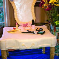 Make-Up Vanity Cake Make-up Vanity Cake. The legs are wood attached to a base hand cut from press board. The "make-up" are all gumpaste pieces. The...