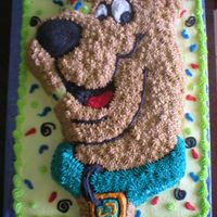 Scooby Doo This is the wilton shaped scooby pan ontop of a 1/2 sheet all buttercream