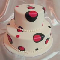 Kami's Shower Cake White fondant covered cake, simple round Wilton cutters used for the circle. I hand painted the pink with Luster dust, I just want...