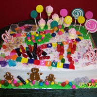 Candy Land Birthday Cake Iced in buttercream. MMF tiles, lollies, and gingerbread. the rest is real candy. Had fun with this one. The 50 year candy aholic was very...