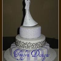 Arquette Wedding 6,9,12" bottom tier choc. fudge/cookies n cream, middle tier vanilla/rasp. mousse, top tier lemon/lemon cream cheese, fondant stripes...