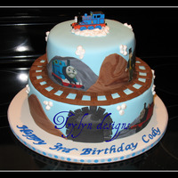 Thomas The Tank Engine 3rd Birthday...Thomas The Tank Engine. This is the 3rd time I have done this cake. Top tier choc/rasp. cc, bottom tier french vanilla/rasp...