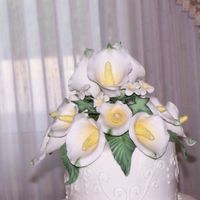 Daughter's Wedding Topper These were my first gumpaste flowers. They were fun to make and I am sure that I will be making many more flowers of all kinds in the near...