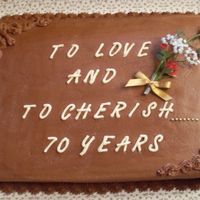 70Th Wedding Anniversary this was done for a couple who are in their 90's. Chocolate cake with chocolate buttercream. Fresh flowers accents.