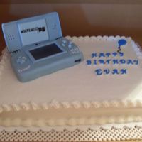 Nintendo Ds Chocolate cake with buttercream frosting, DS is covered in fondant and gumpaste mixture