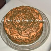 Mehendi Cake Eggless chocolate cake iced in saffron color BC with mehendi green henna pattern. Great for Indian bridal shower or sangeet party, hafla,...