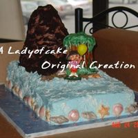 Dora Volcano Island Cake Chocolate pound cake with cookies n cream filling on bottom, volcano is deep chocolate with cherry filling (think black forest), chocolate...