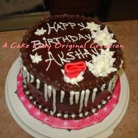 Chocolate - Decorated With Nephew I really enjoyed helping my nephew decorate his birthday cake: he made the rose out of his favorite Airhead candy and icicles / white...