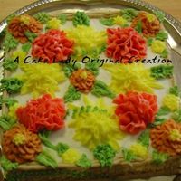 Autumn Spice Cake I hate this cake. Did it for Thanksgiving one year and tasted good but looks bad!Spice cake filled with lemon curd, iced in BC. Marigolds...