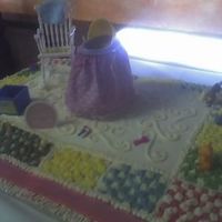 Baby Shower Cake I made this for a friend, it is suppose to be a rug and I put a bassinetontop and some toys