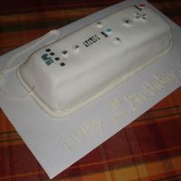Wiimote First bday cake for my brother who LOVES to play with just the remote controller for the Wii. All MMF and painted food coloring. the cake I...