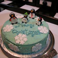 Fondant Penguins My first time with MMF. Managed to do the figurines. Tried covering the cake, but... didn't quite turn out as planned. Snowflakes were...