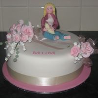 Mothers Day Cake made for a mothers day fundraiser. Fruitcake iced in fondant. Female figure inspired by ains2's tutorial