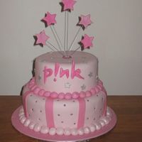 Pink birthday cake for my friends daughters 16th. Caramel mud bottom, marbled butter cake on top. covered in fondant