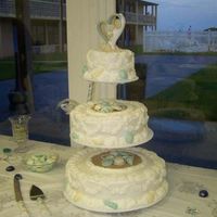Seashell Wedding Cake I love doing beach wedding cakes. This cake was cream cheese flavorwith butter cream icing. The bride and groom loved it.
