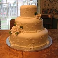 Img_4591.jpg Choc fudge and ameretto pound cake with bc icing. Bride gave me a picture, not sure who to credit the design to!