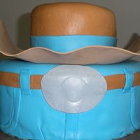 Western Groom's Cake I can't seem to get my fondant on the cake without it puckering . . . any suggestions?