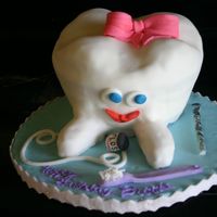 Brookes Tooth made for a dental hygeinists birthday who happens to be my best friend. Inspired by several other CC's/ all fondant