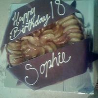 Apple Cheesecake With Chocolate Scrolls this is a 12 inch caramel apple cheesecake. the writing could not be done on top of the apple so i made chocolate ribbon scroll things and...