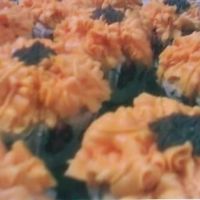 Flower Cupcakes first attempt at flower cupcakes. i underestimated the power of gel colours and got a brughter orange than i expected.