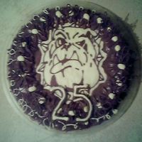 Chocolate Runout Bulldog made for a 25th birthday for a bulldog breeder. chocolate mud cake covered in ganache.12 inch round with a chocolate transfer of a typical...