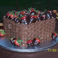 Death By Chocolate My first groom's cake, I don't really understand that tradition... Anyhow it's a triple chocolate cake w/ a chocolate...