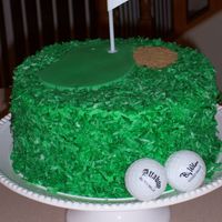 Dad's Birthday German Chocolate cake with tinted coconut. Fondant green, brown sugar bunker, and gag gift golf balls. This was fun to do!